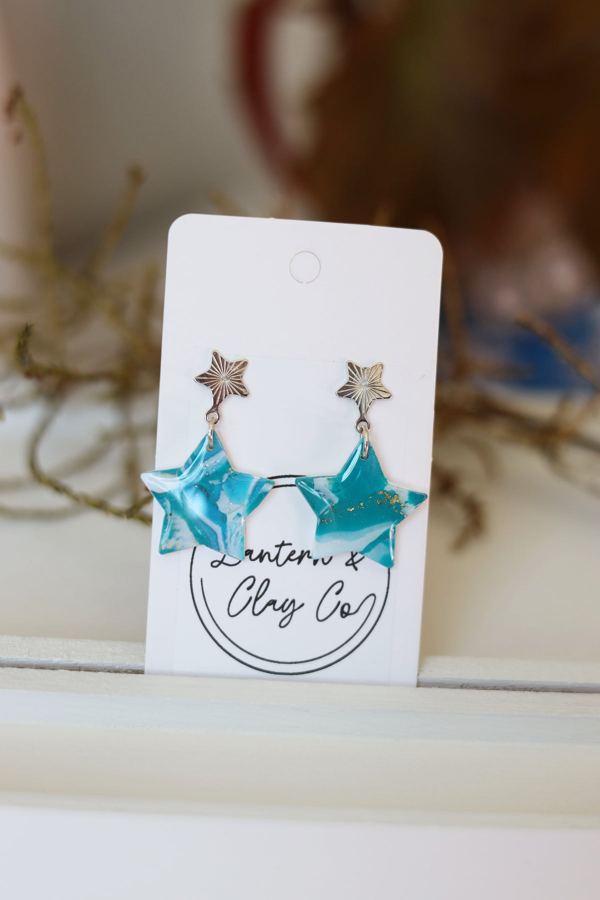 Starry blue and white dangle earrings