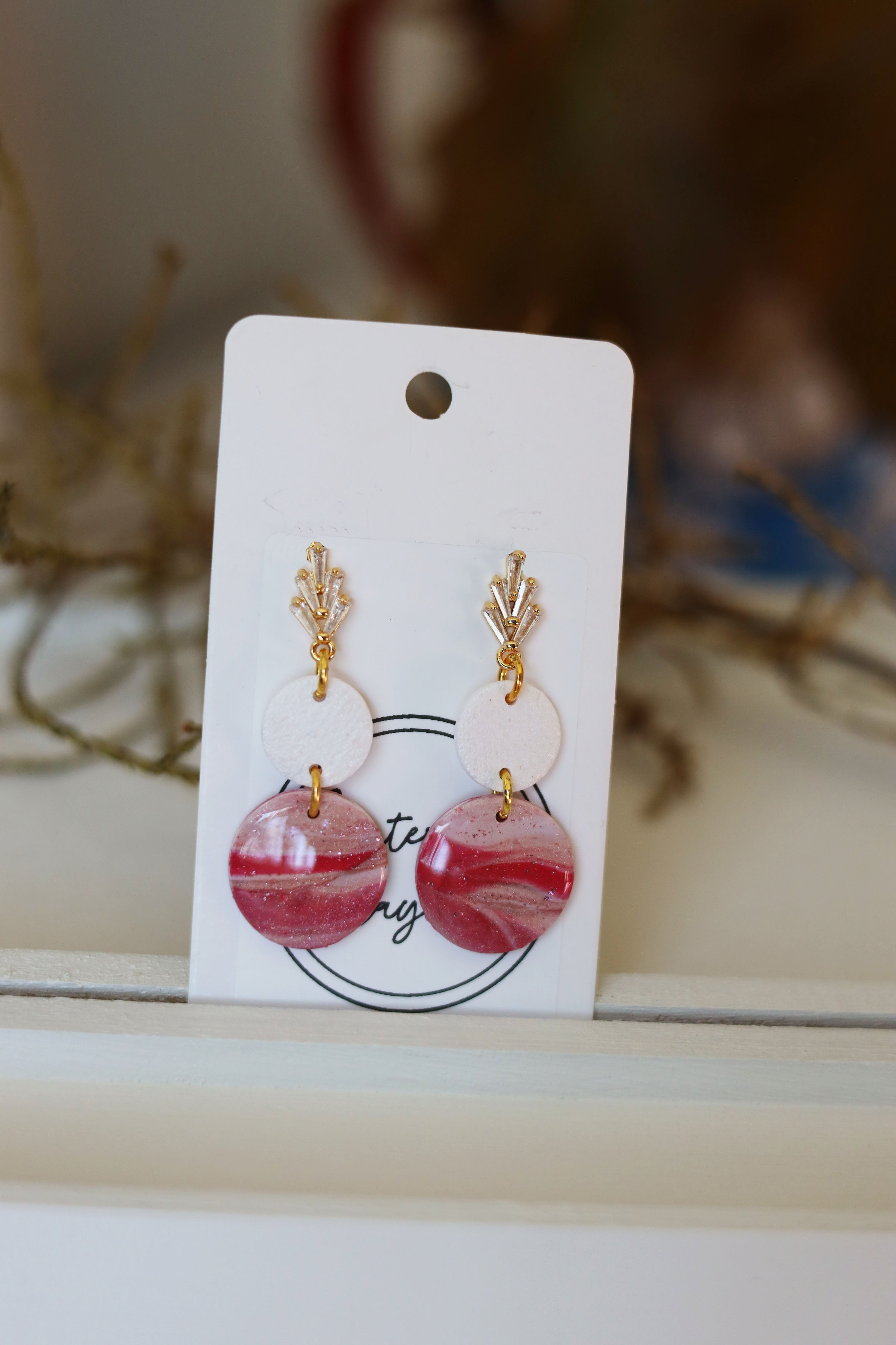Pink, beige and white dangle earrings with rhinestone studs