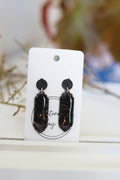 Black dangle earrings with rose gold foil