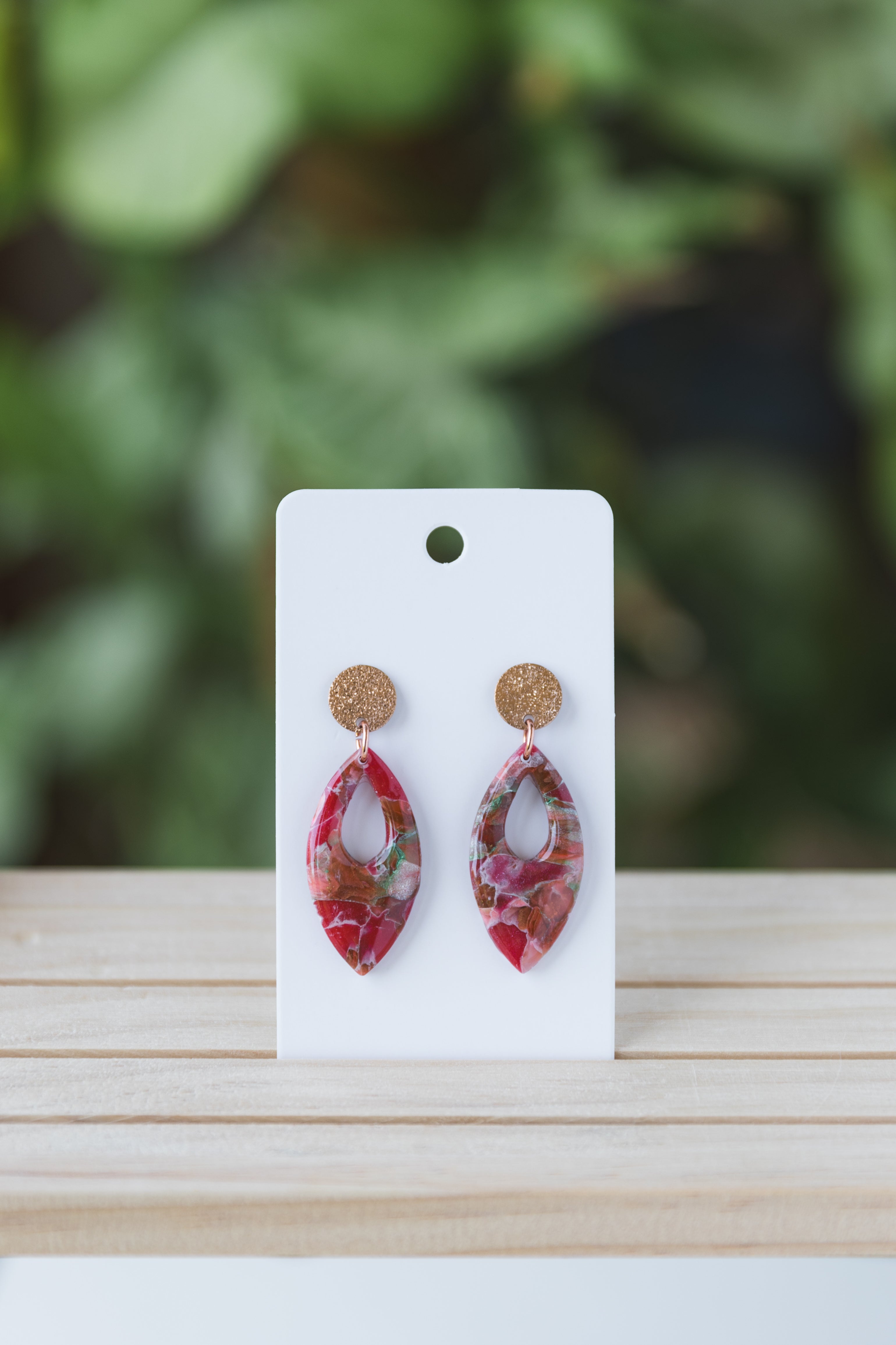 Magenta with specks of green faux stone dangle earrings