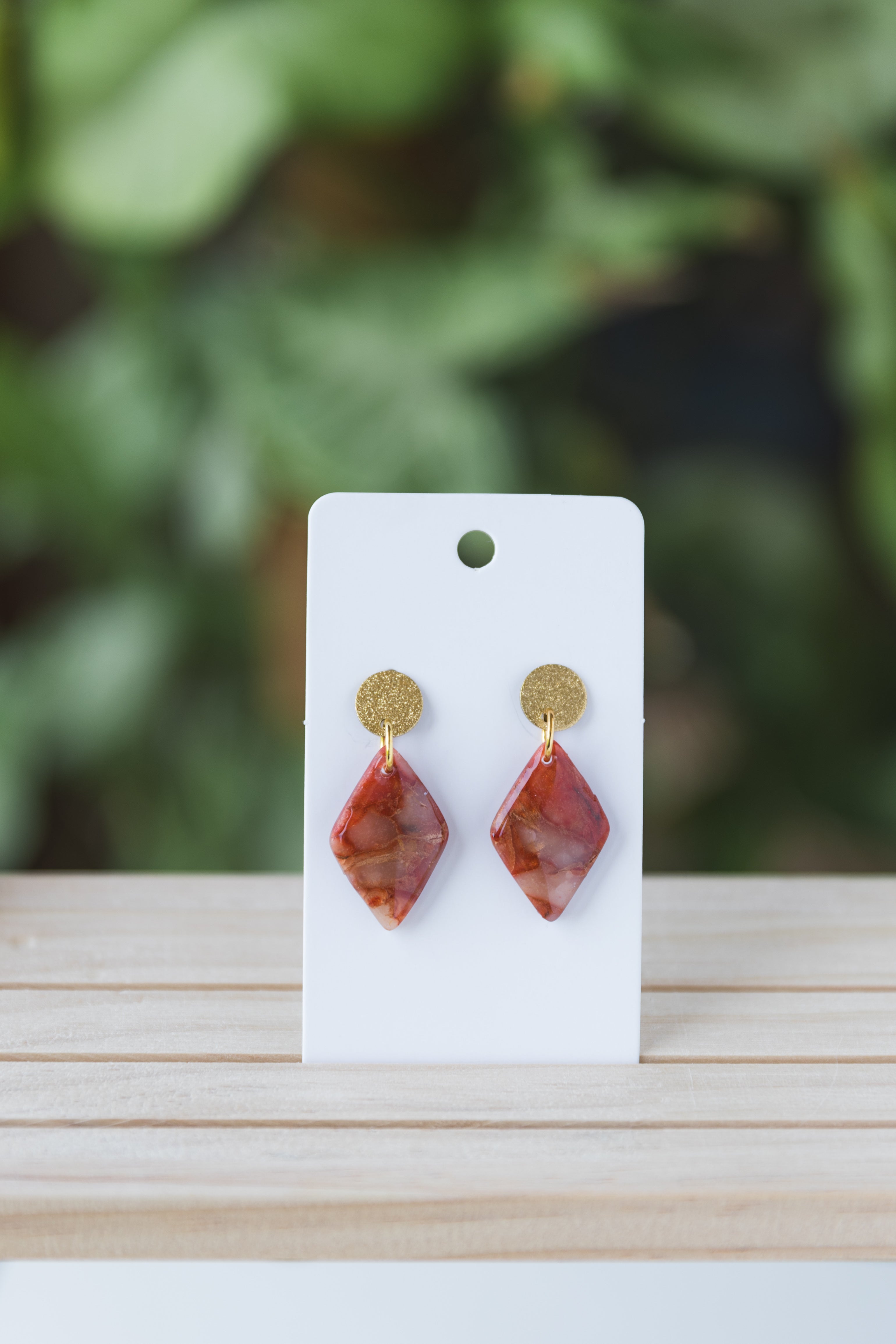 Red faux stone dangle earrings