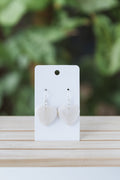 White faux stone heart dangle earrings