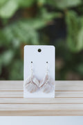 White and cream faux stone dangle earrings