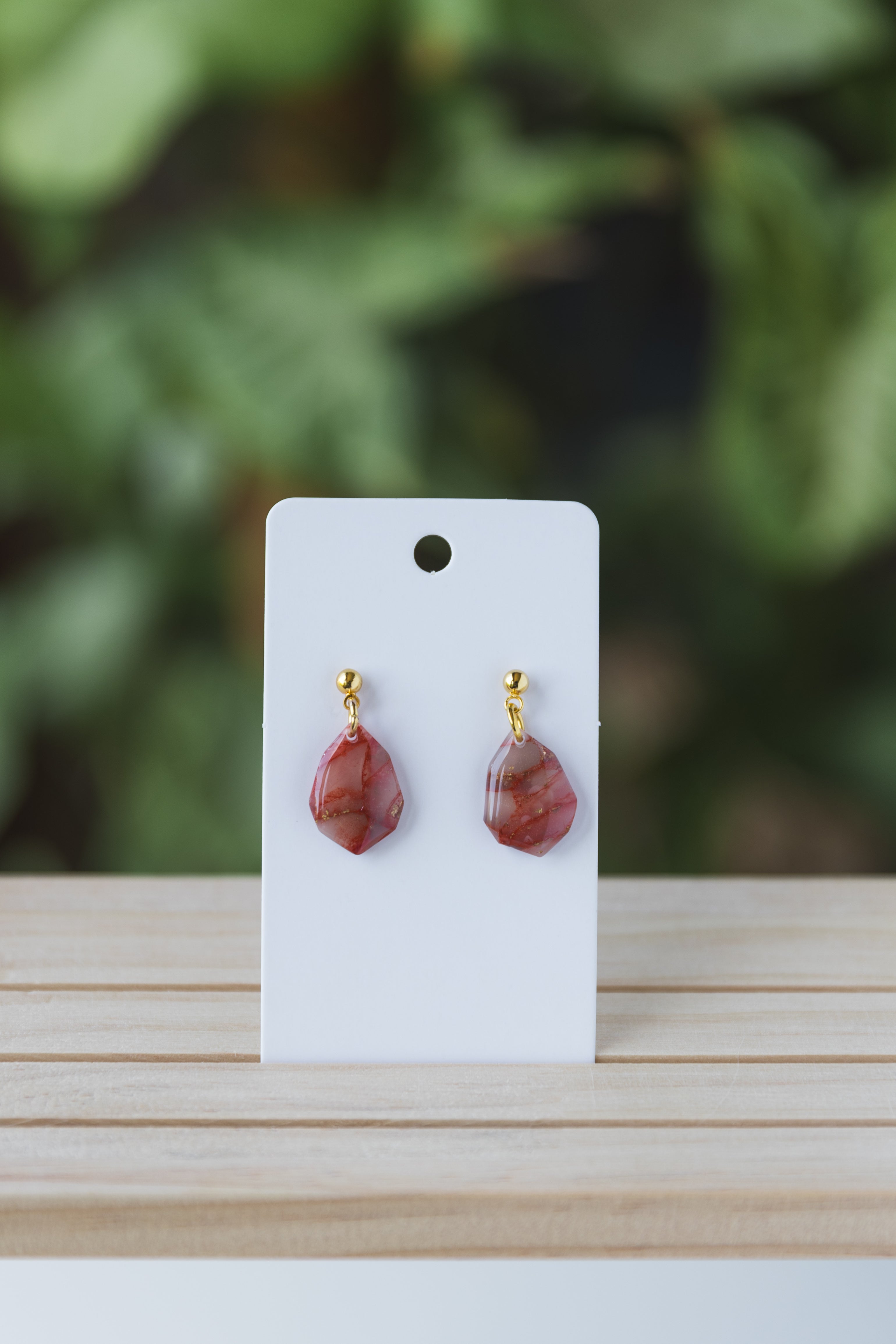 Red faux stone dangle earrings