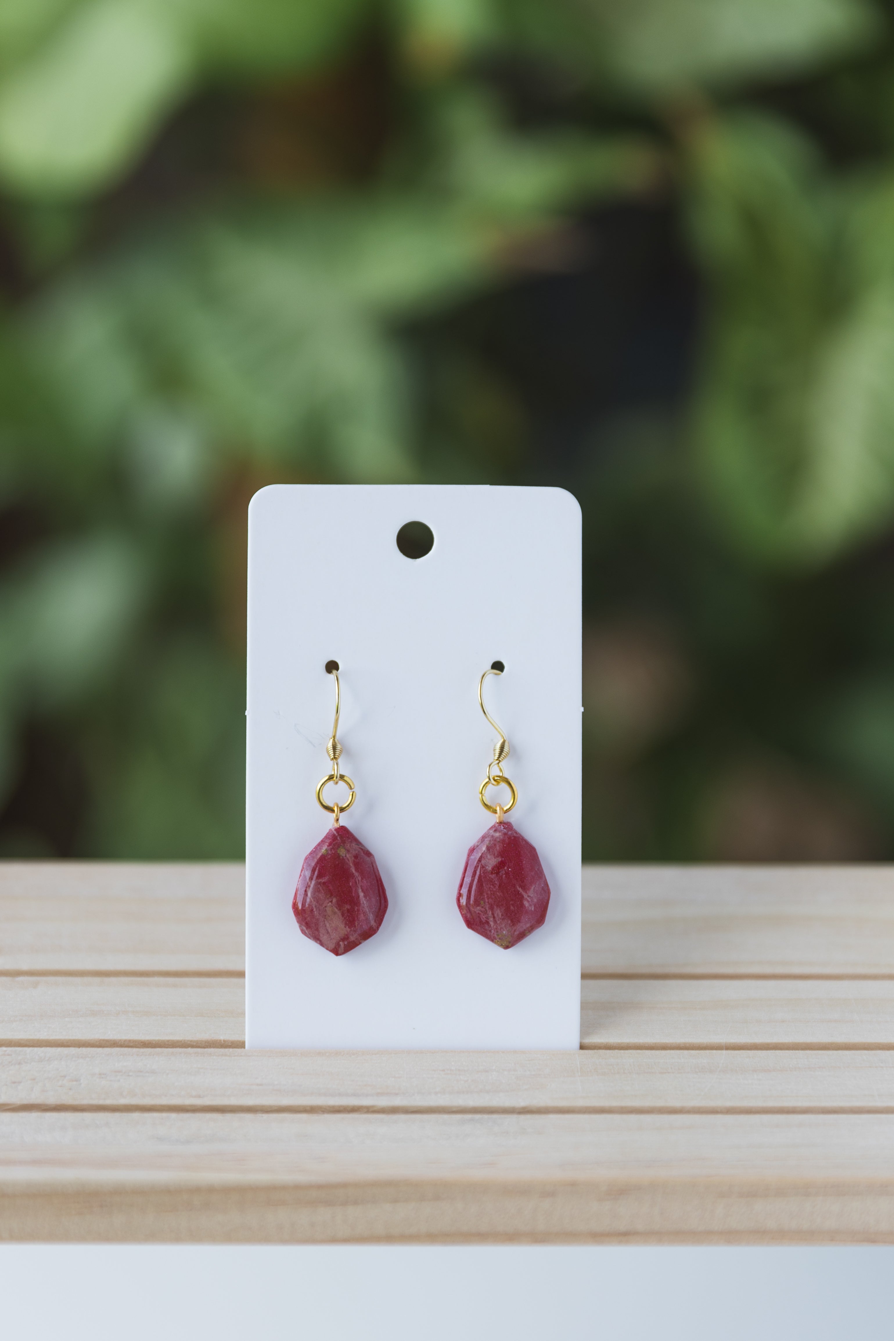 Red faux stone dangle earrings