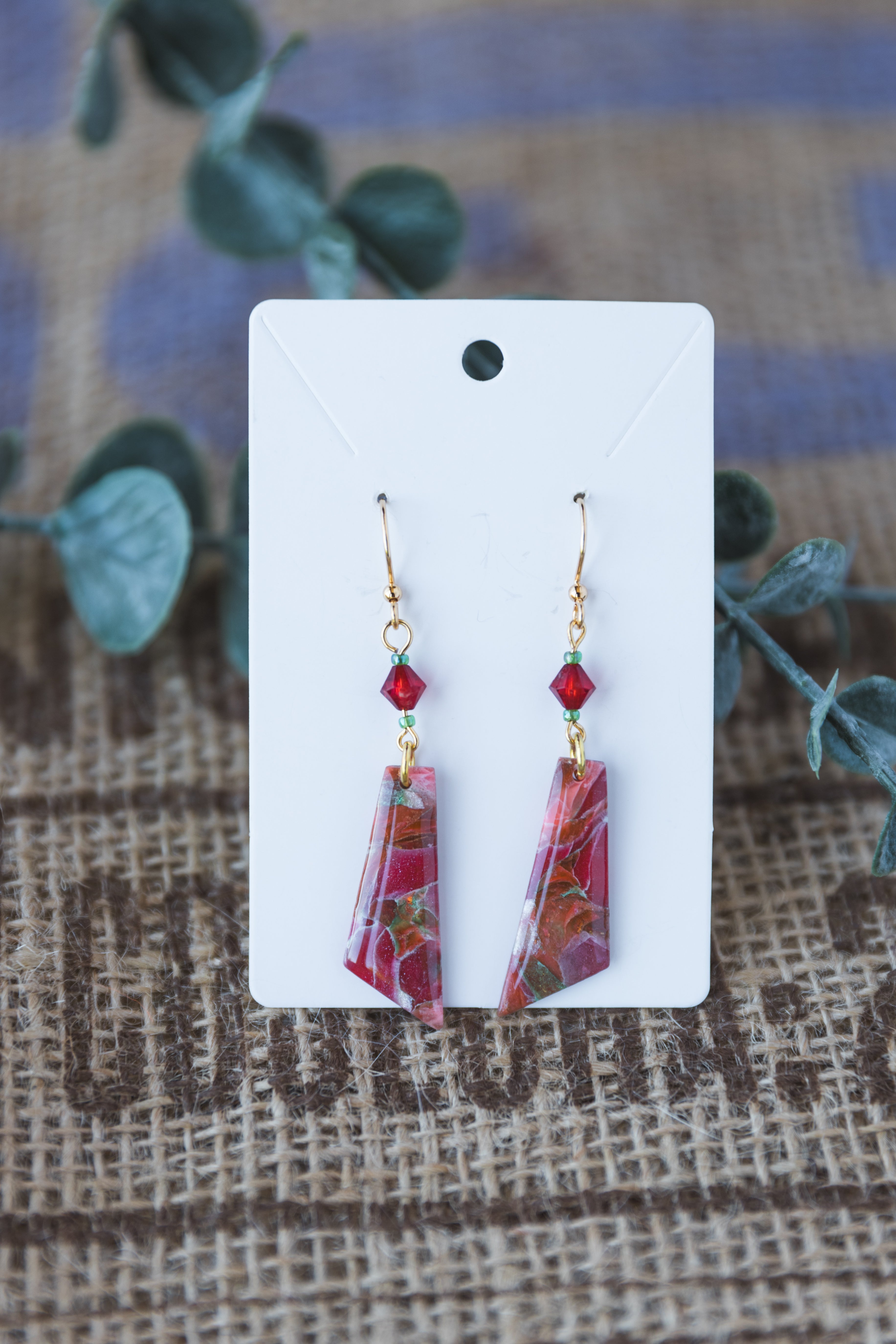Magenta with specks of green faux stone dangle earrings